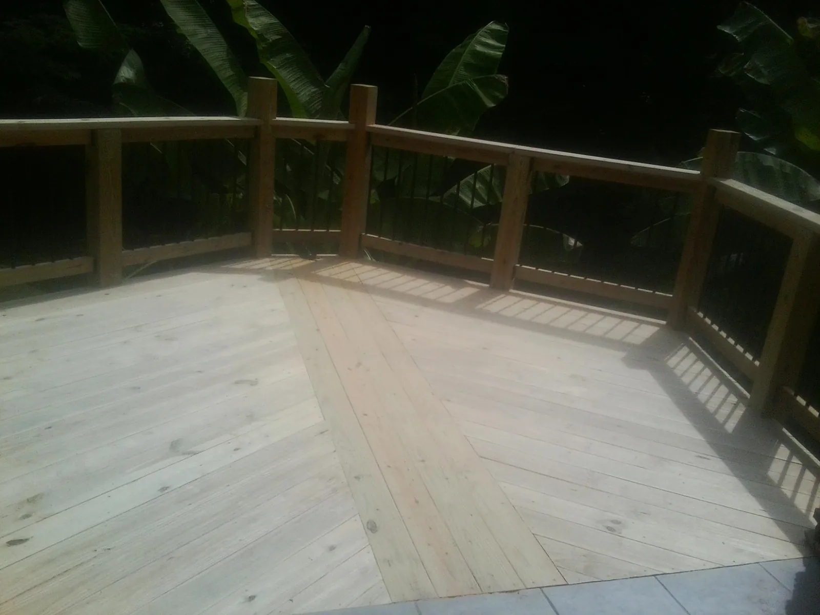 New wood deck and railing built off the back of a home in Almont